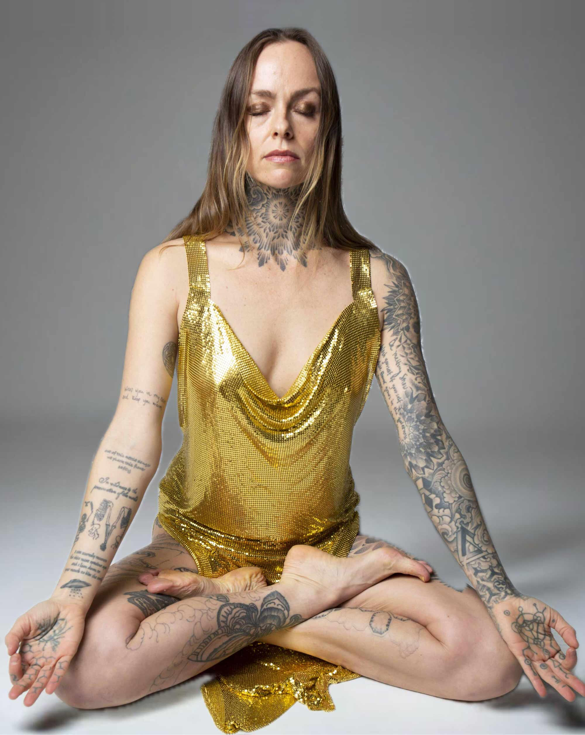 Woman sat in Sukhasana / Easy pose meditating